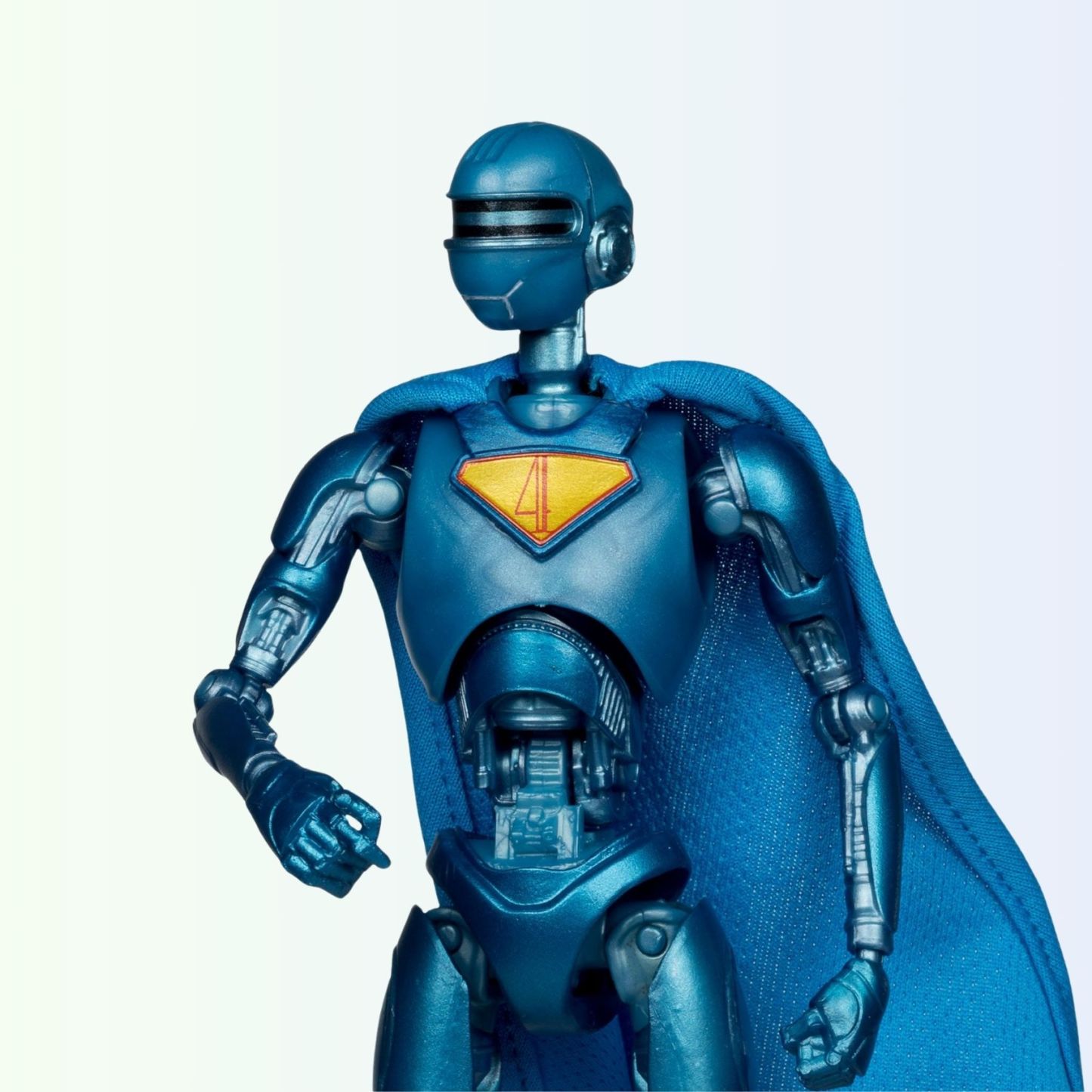 Close-up shot of Superman Robot action figure upper half, showing metallic detail and number 4 emblem