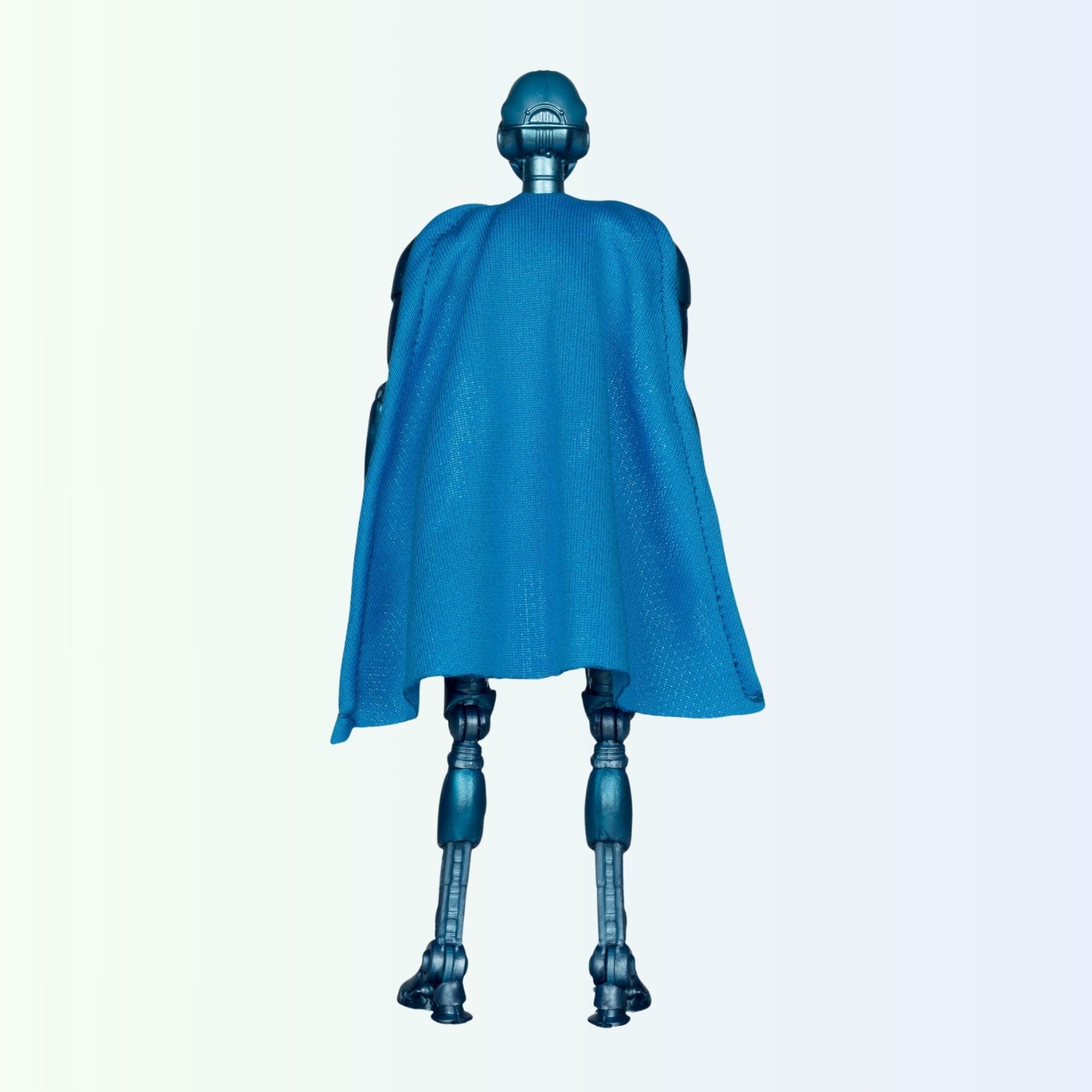 Rear view of Superman Robot action figure showing full wired fabric cape from behind