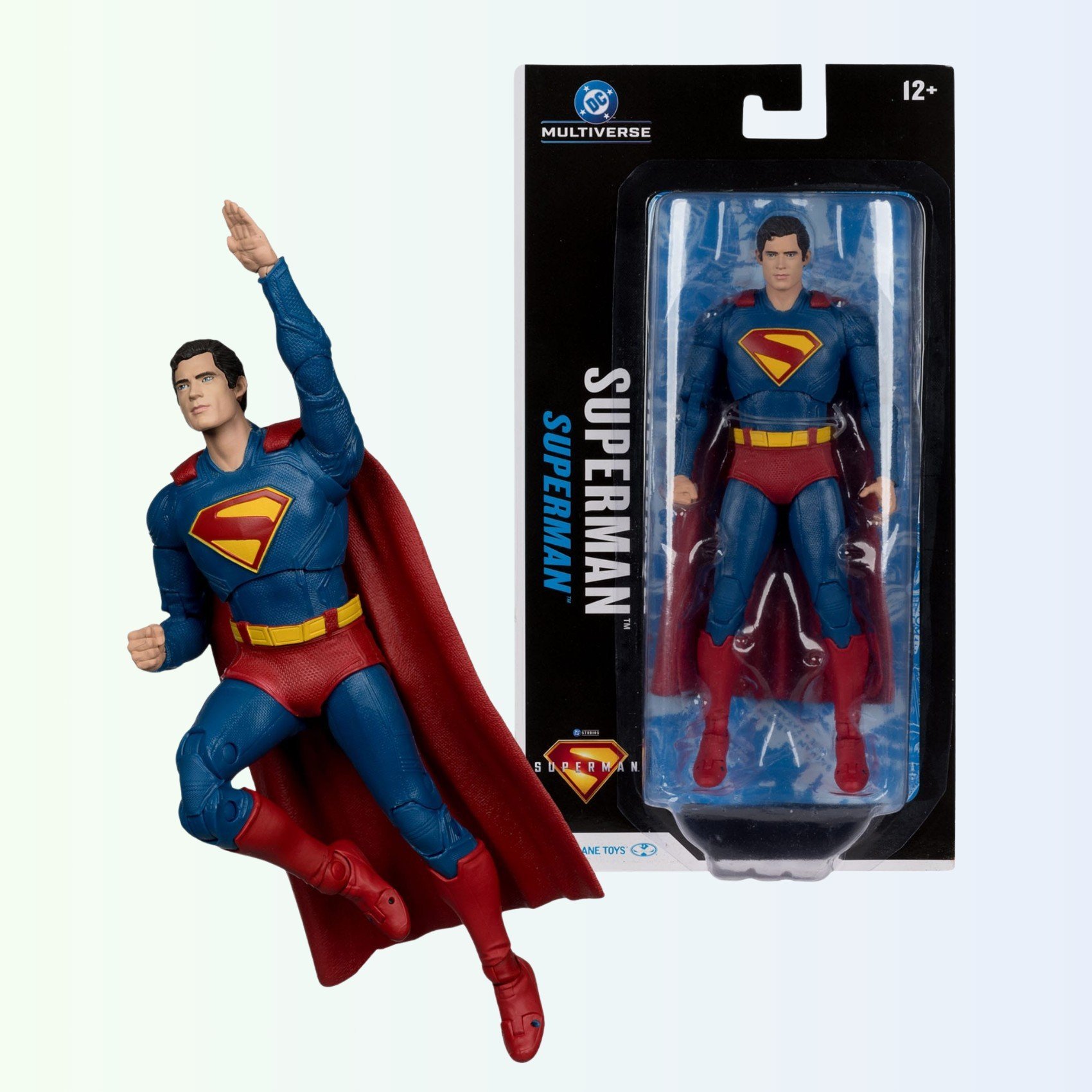 Superman action figure in flight next to blister packaging showing full product
