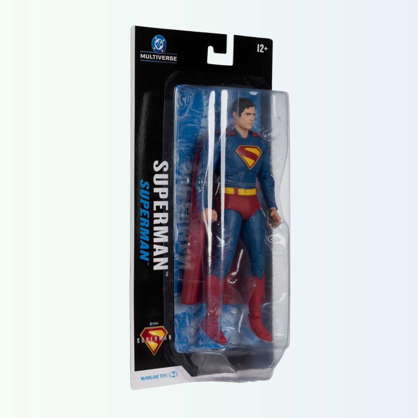 Angled side view of Superman action figure in blister packaging