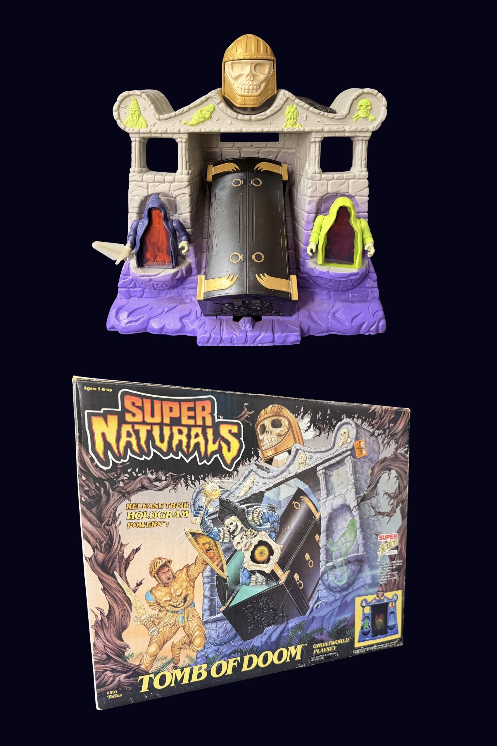 Assembled Tomb of Doom playset with Ghostlings See-Thru and Spooks beside the closed black coffin doors, with the original box pictured below