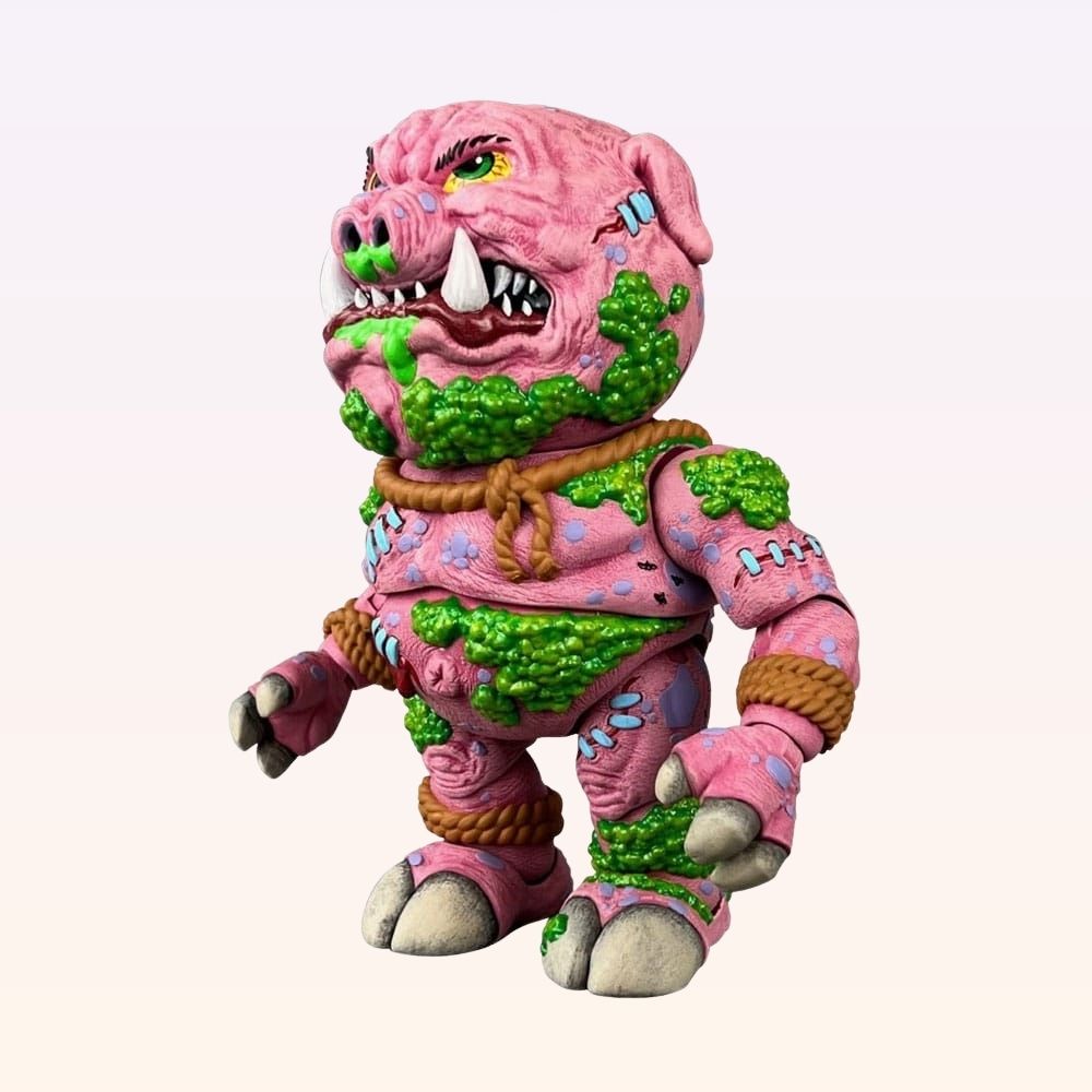 Left side view of Swine Sucker Madballs action figure showing slime patches and tusked snout