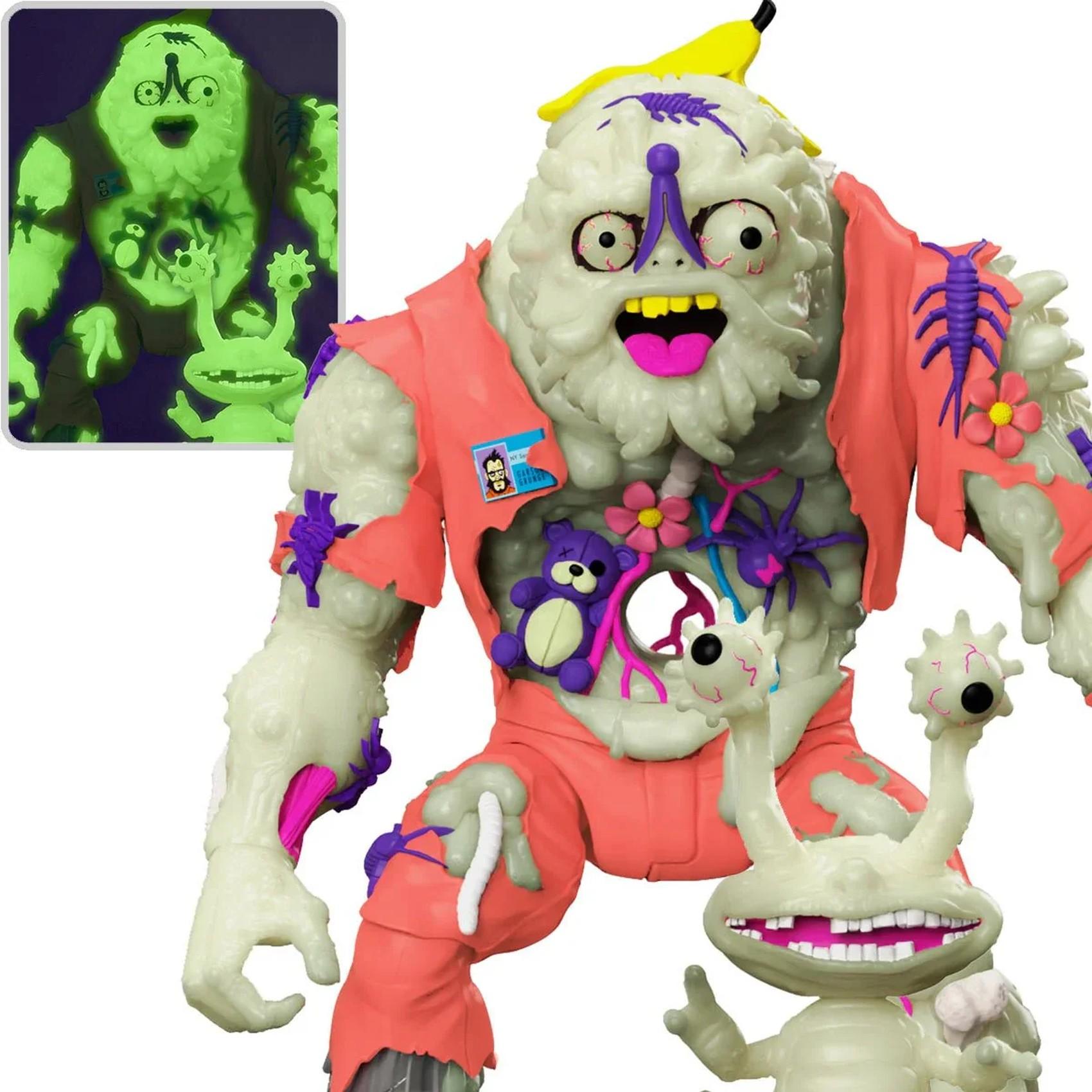 Close-up of Muckman and Joe Eyeball action figure showing glow-in-the-dark effect in inset corner