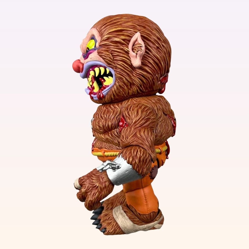 Left side shot of Wolf Breath Madballs action figure showing sharp fangs and bandaged arm