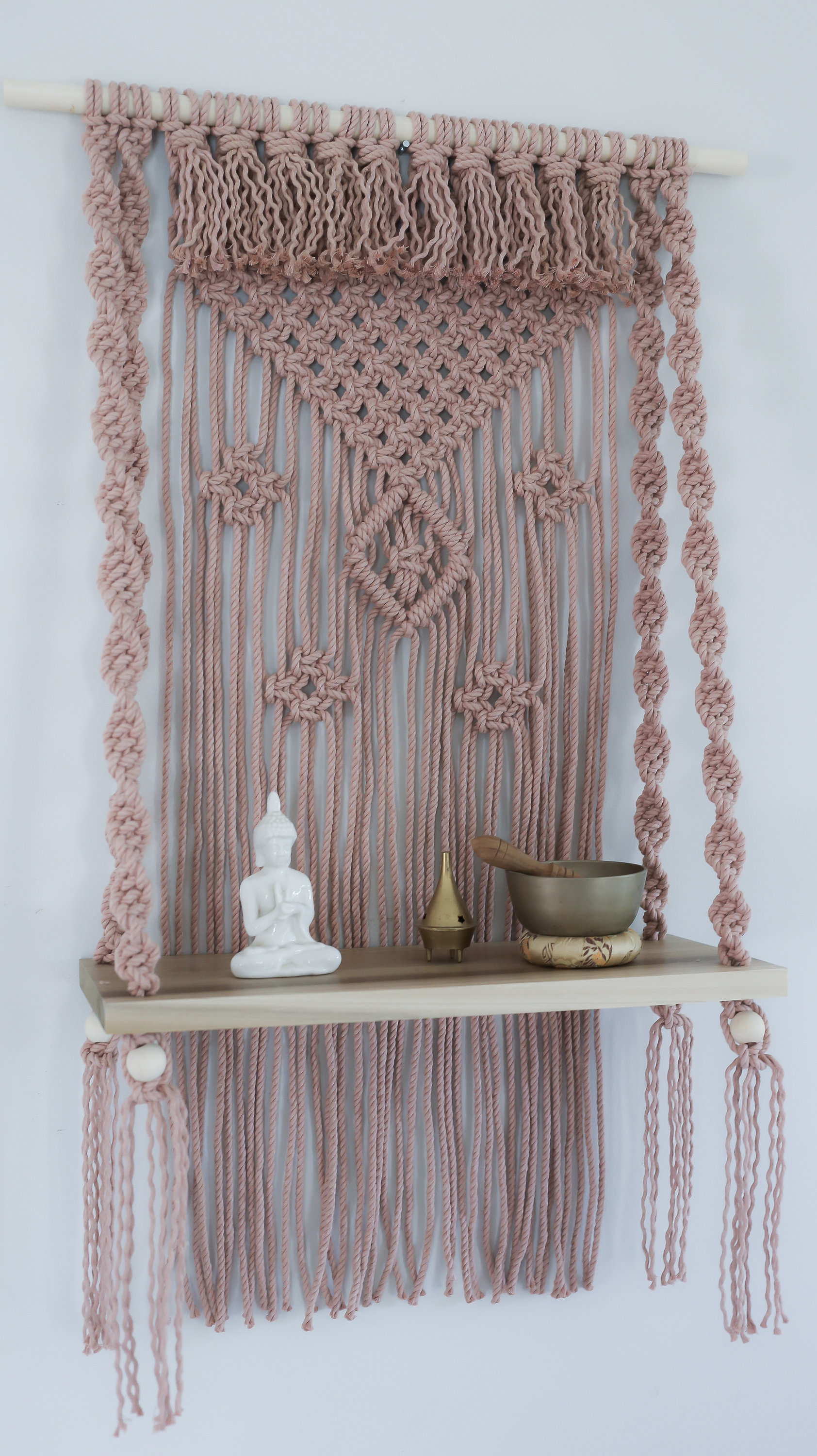 Materials: cotton cord, wood dowel, polar wood shelf, wood beads  Width: 22 inches Height: 36 inches Depth: 8 inches Gift wrapping available About this item Handcrafted decorative wall hanging with 18" poplar wood shelf. This hanging side table is eye cat