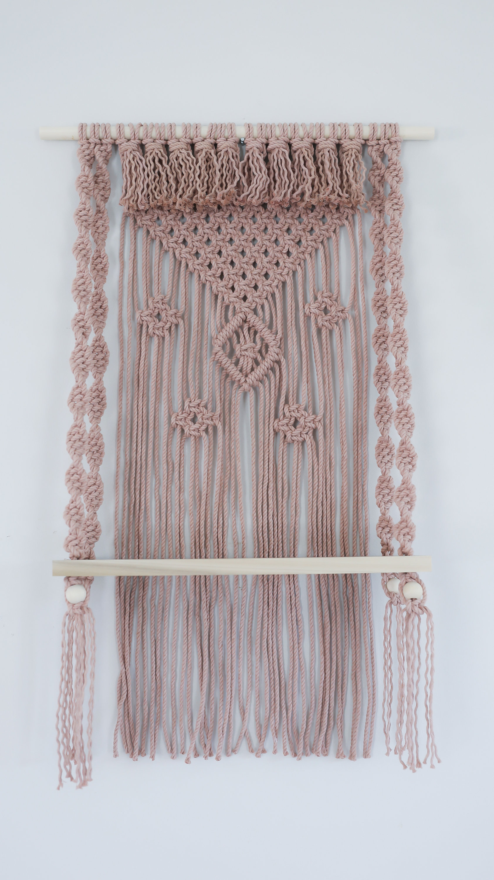 Materials: cotton cord, wood dowel, polar wood shelf, wood beads  Width: 22 inches Height: 36 inches Depth: 8 inches Gift wrapping available About this item Handcrafted decorative wall hanging with 18" poplar wood shelf. This hanging side table is eye cat