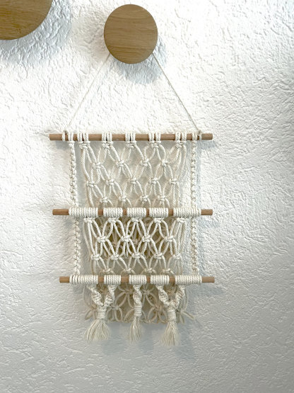 Macrame wall storage for cuddly toys, plants, magazines and much more.
