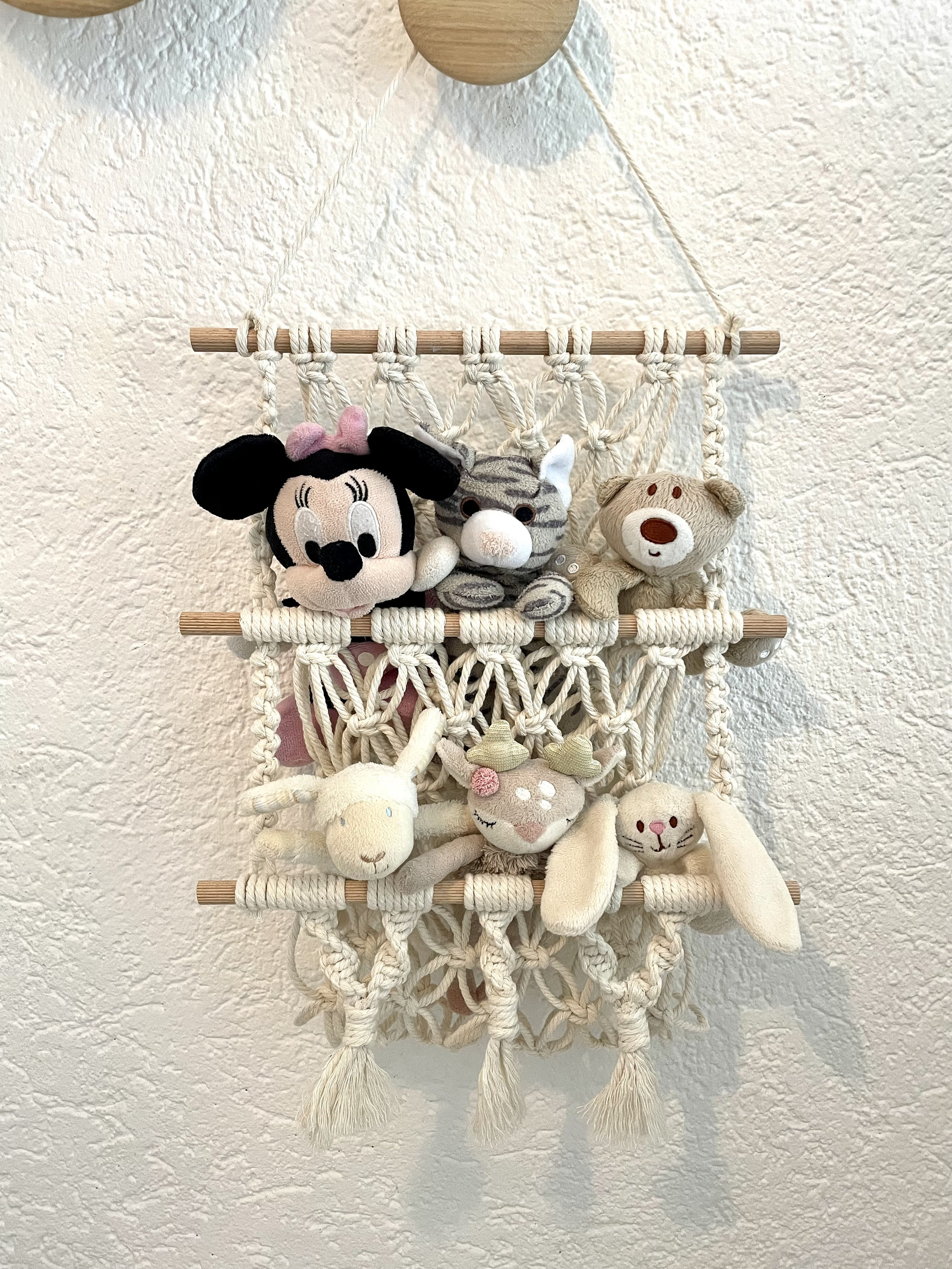 Macrame wall storage for cuddly toys, plants, magazines and much more.