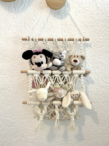 Macrame wall storage for cuddly toys, plants, magazines and much more.