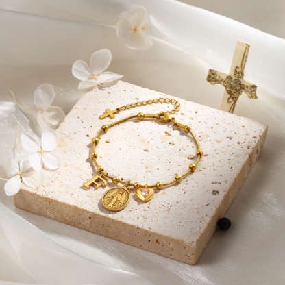 Armband in Gold mit Jungfrau Maria, Kreuz, Geburtsstein und Initiale