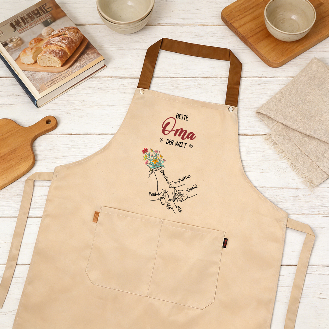 Personalisierte florale Küchenschürze mit Händchenhalten-Motiv und 2–7 Namen Geschenk für Mama oder Oma