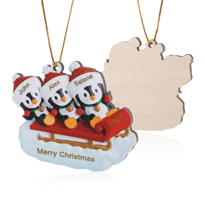 Holz Weihnachtsornament-Personalisierter Text & 2-6 Namen & Jahr niedliche Pinguin auf dem Schlitten Weihnachtsbaum-Anhänger