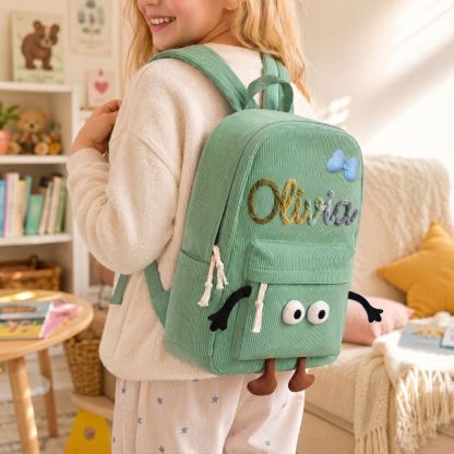 Personalisierter Kinderrucksack mit Namen aus Cord mit lustigem Comic-Gesicht als Geschenk für Kinder