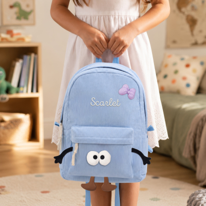Personalisierter Kinderrucksack mit Namen aus Cord Namensstickerei mit lustigem Gesicht und Schleifen-Patch