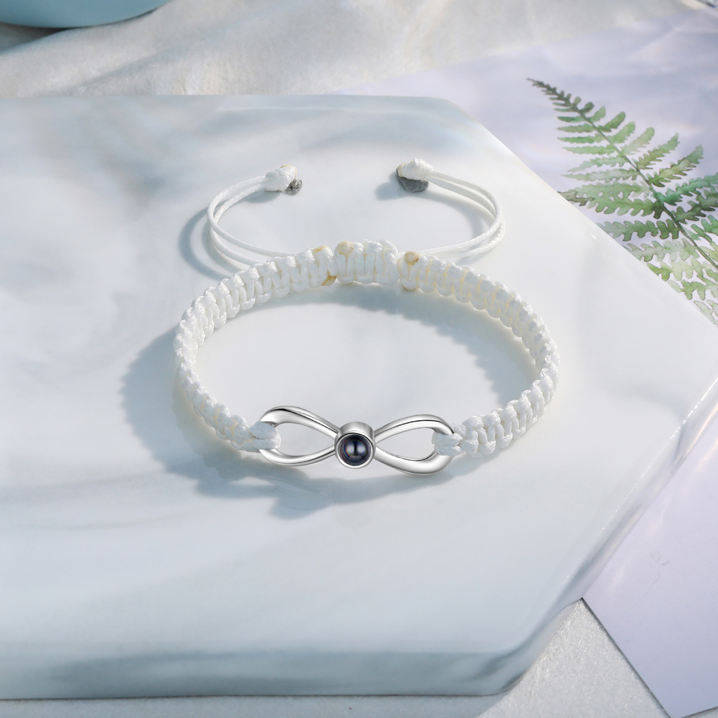 Pulsera con proyección de foto en color con dije de lazo y 3 colores de cuerda ajustable-Jessemade ES