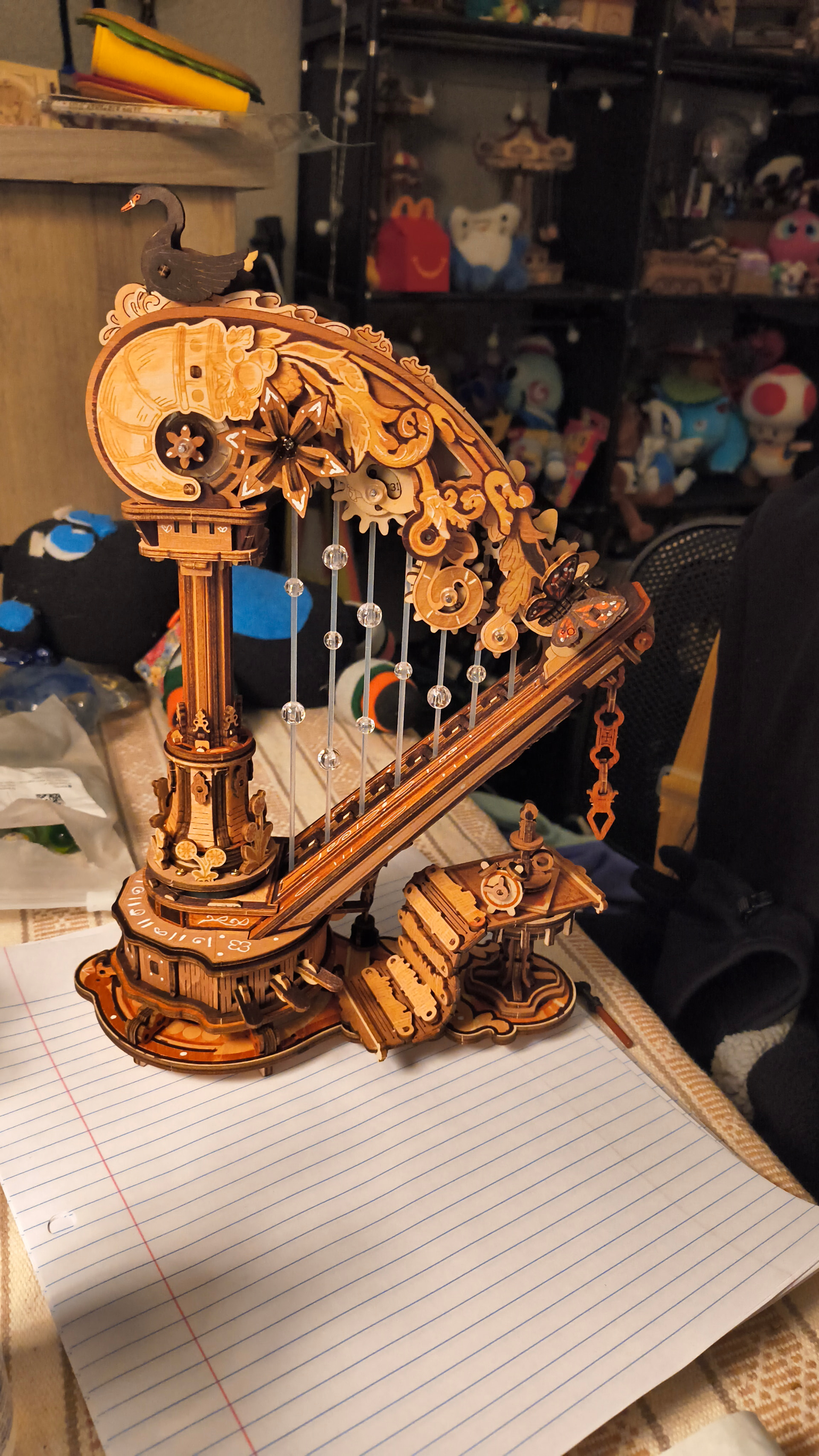 Dasabucket&rsquo;s finished ROKR Magic Harp with custom brown coloring, white details, swan, butterfly, strings, and visible gears