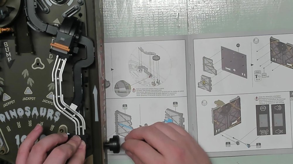 Wire-style ramp being fitted to the Dinosaur Lab Pinball playfield