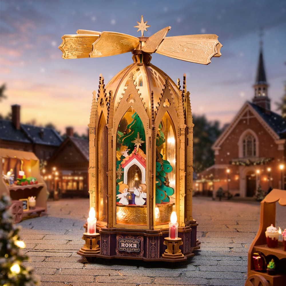 ROKR Angel’s Christmas Pyramid with a gold rotor above its illuminated Christmas scene