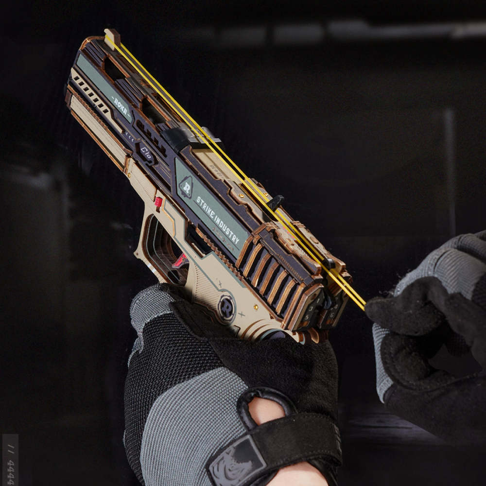 Gloved hand loading a rubber band onto the ROKR Legato C18 Pistol
