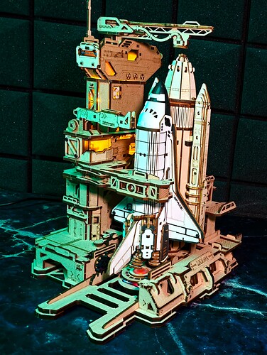 ROKR Space Shuttle LKA02 displayed with dramatic colored lighting