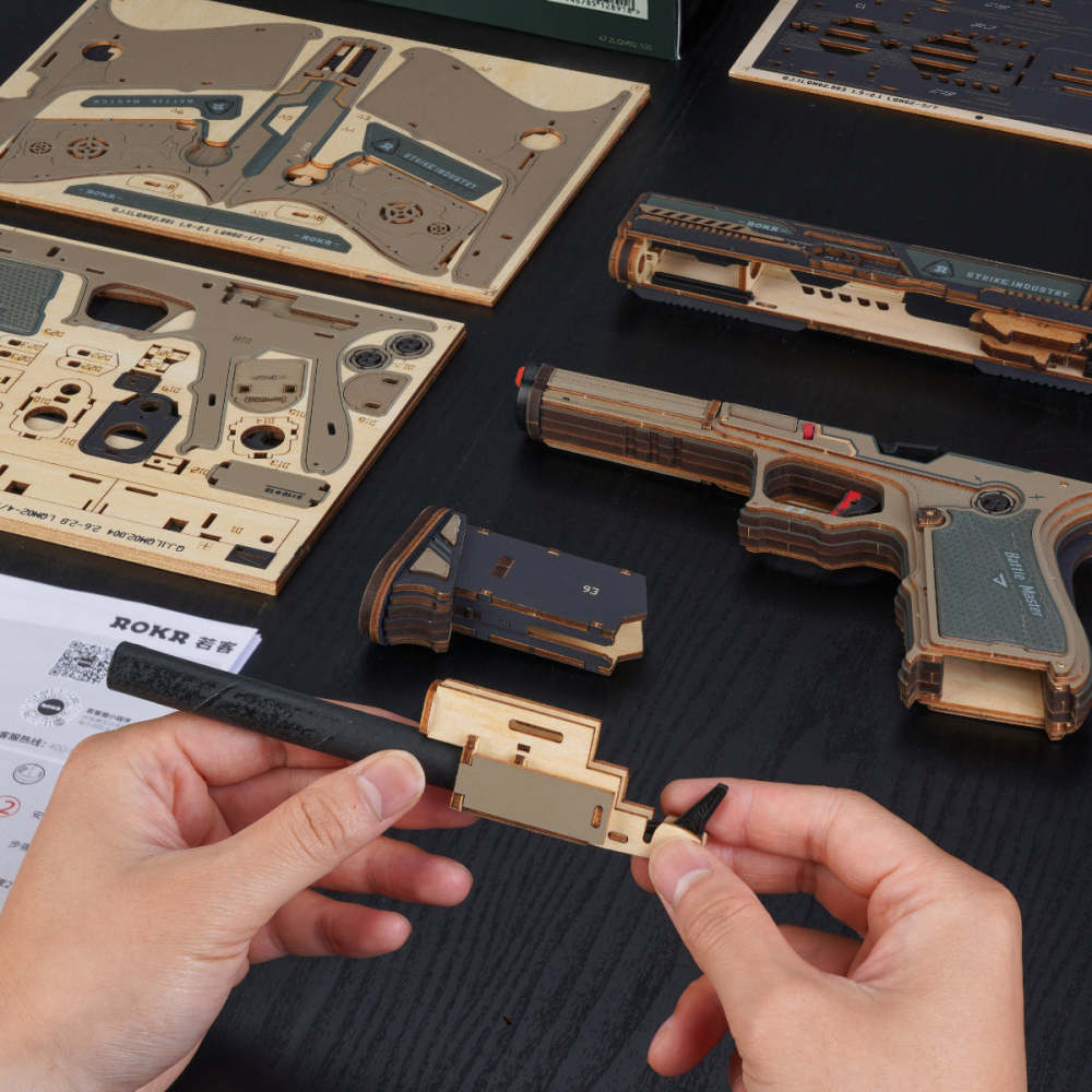 Laser-cut wooden sheets and partly assembled Legato C18 slide being fitted by hand