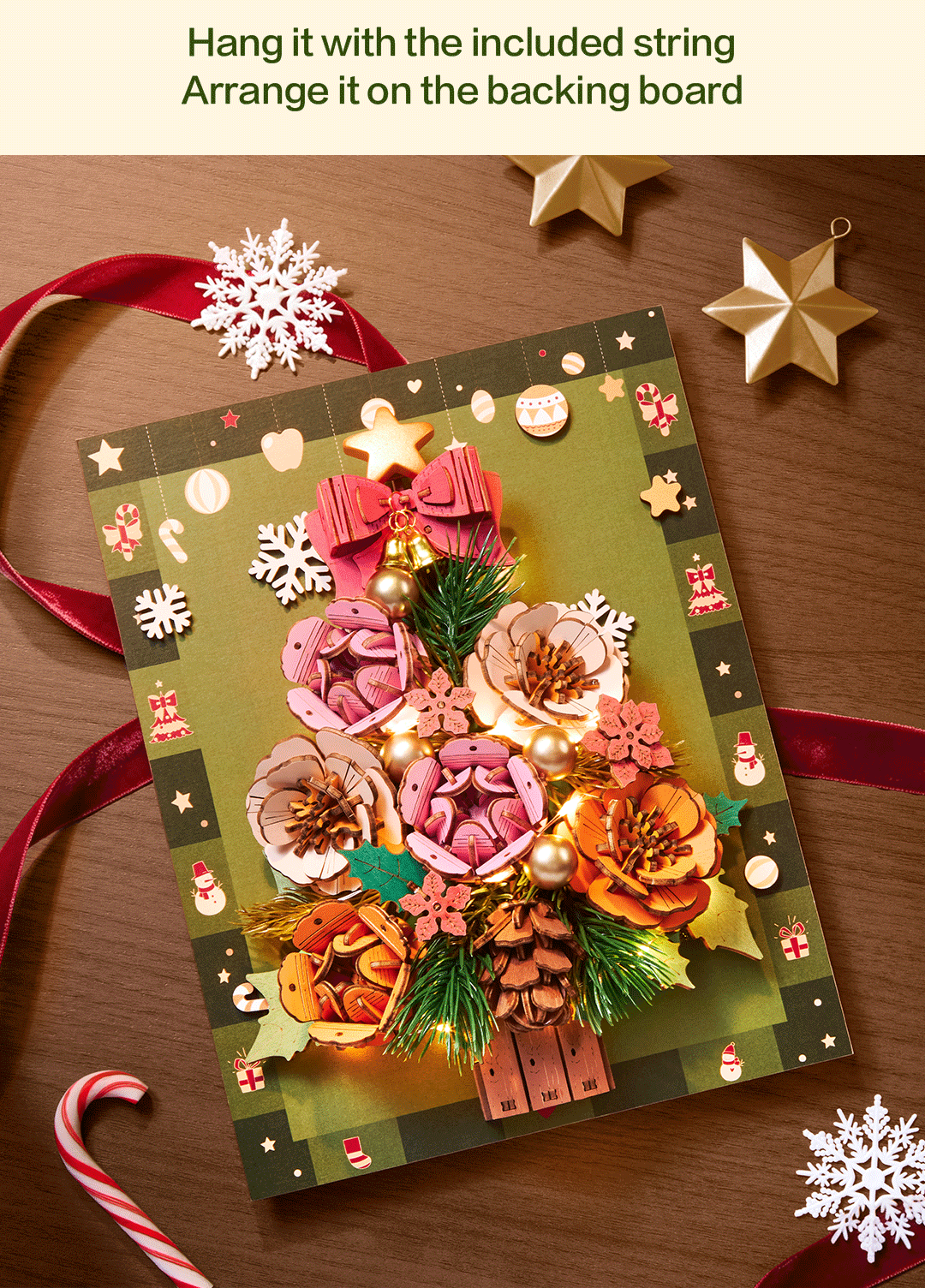 Everglow Christmas Tree hanging on its illustrated holiday backing