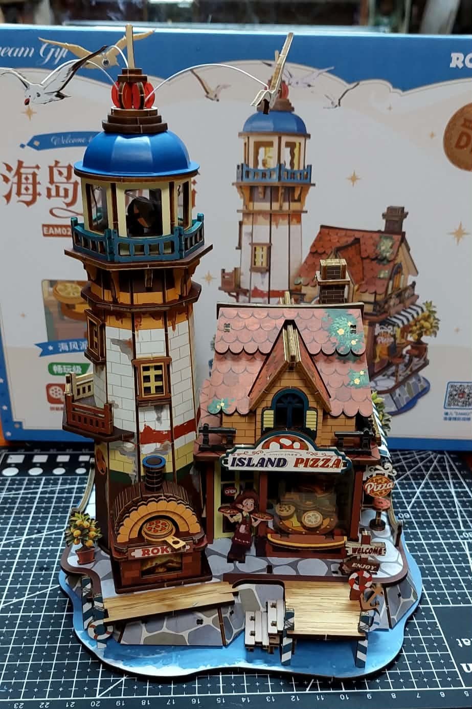 Gidge's completed ROKR Chillbay Pizzeria model with lighthouse and pizza shop