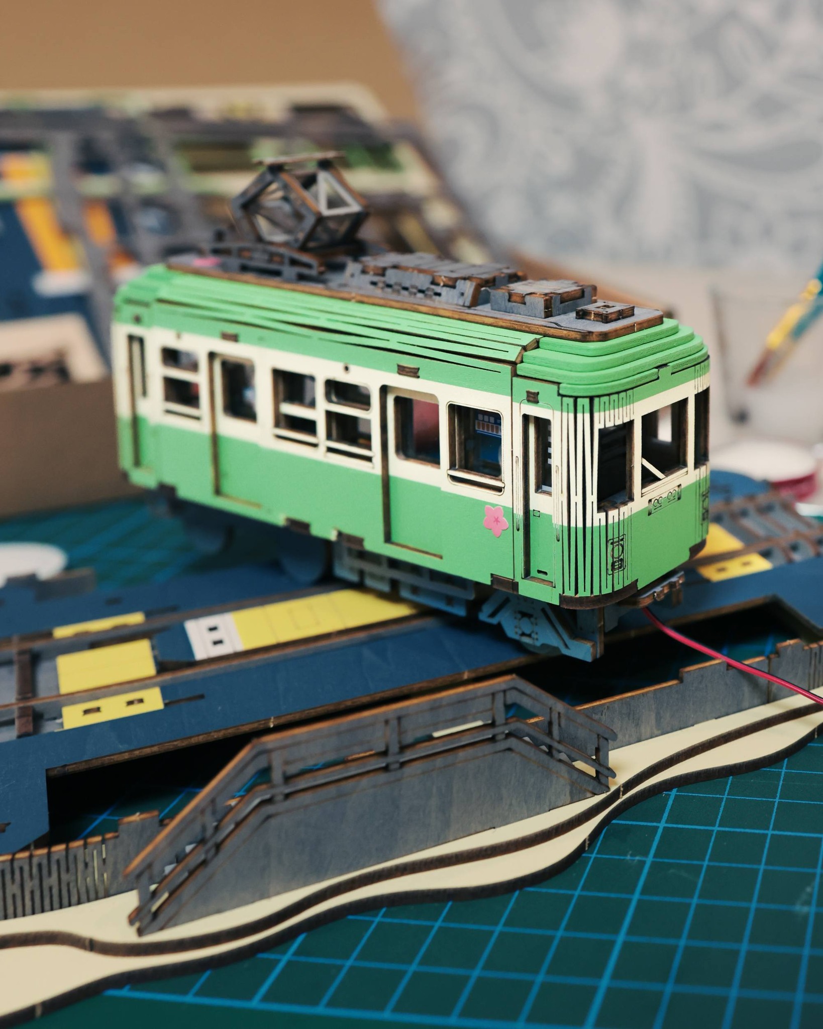 A customized green-and-cream miniature tram shared at the Melbourne Robotime meetup