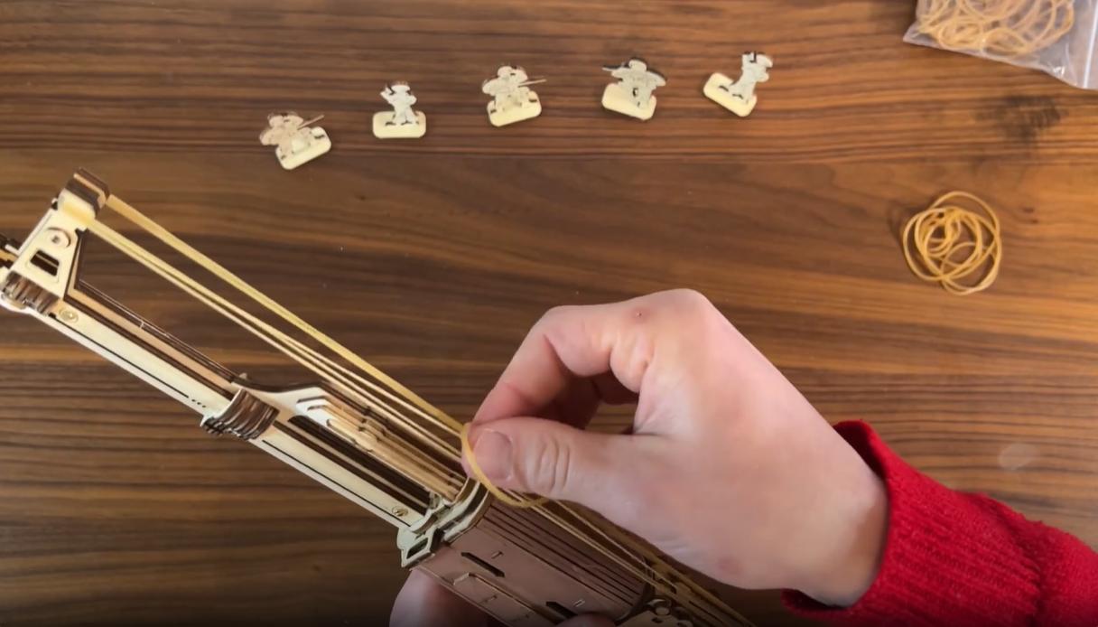 Load rubber-band bullets into the ROKR AK-47