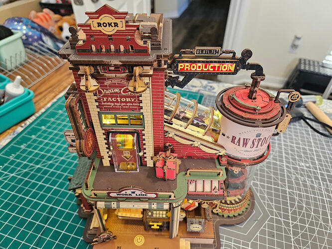 Another look at the assembled factory showing the colorful mechanical storytelling.