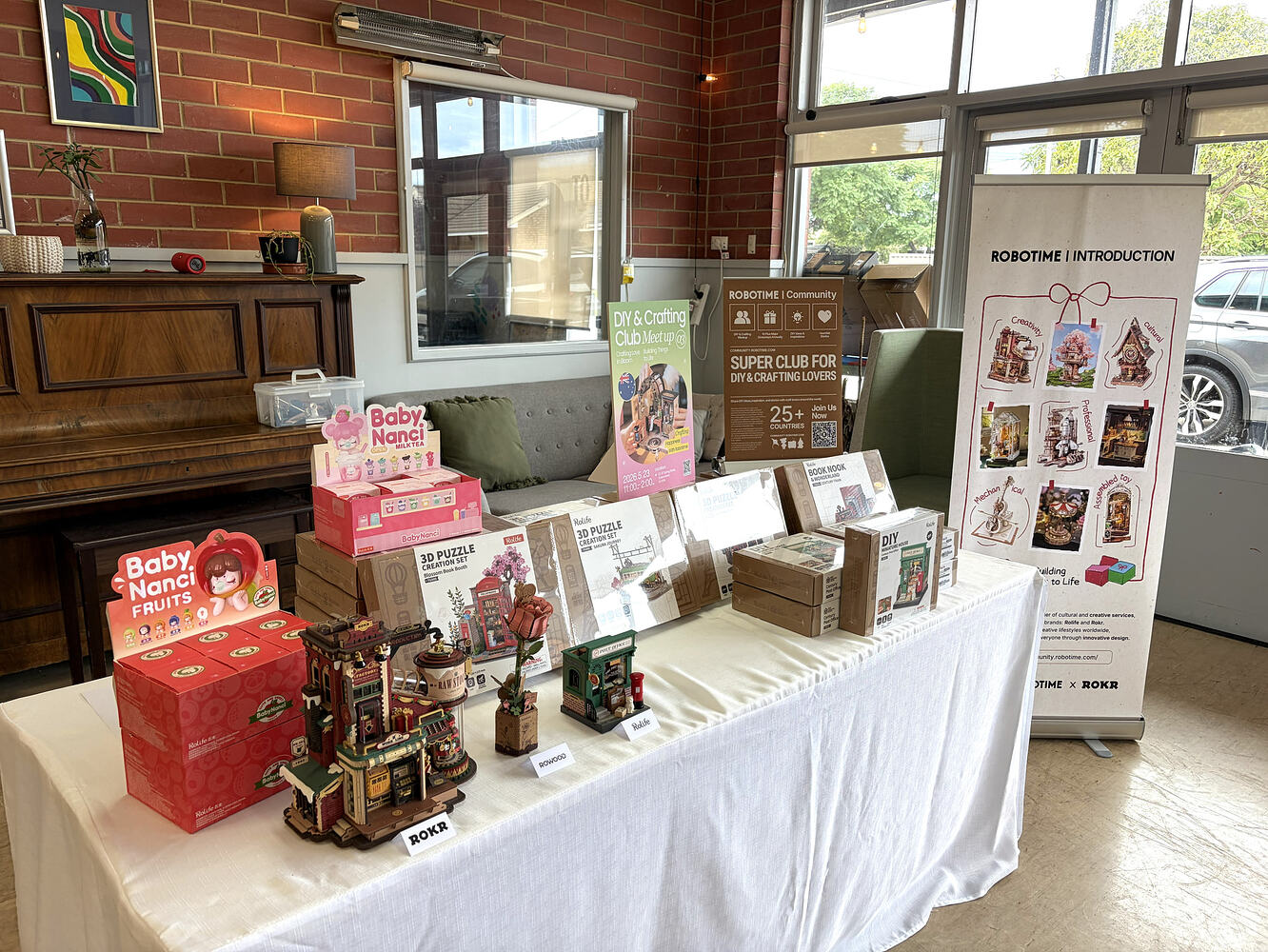 Robotime kits and Baby Nanci dolls displayed at Jo_Zanella's Queenstown meetup
