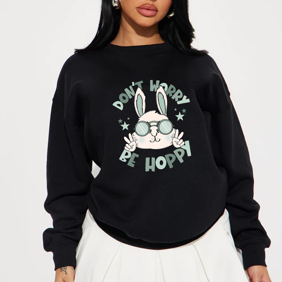 "Don'T Hoppy" Slogan And The Image Of A Rabbit Wearing Sunglasses, A Rabbit Holding Up Two Fingers And Making A "V" Sign, A Casual Sports Shirt, And A Crew Neck Sweatshirt.