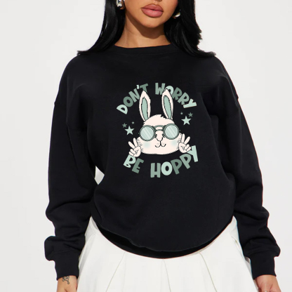 "Don'T Hoppy" Slogan And The Image Of A Rabbit Wearing Sunglasses, A Rabbit Holding Up Two Fingers And Making A "V" Sign, A Casual Sports Shirt, And A Crew Neck Sweatshirt.