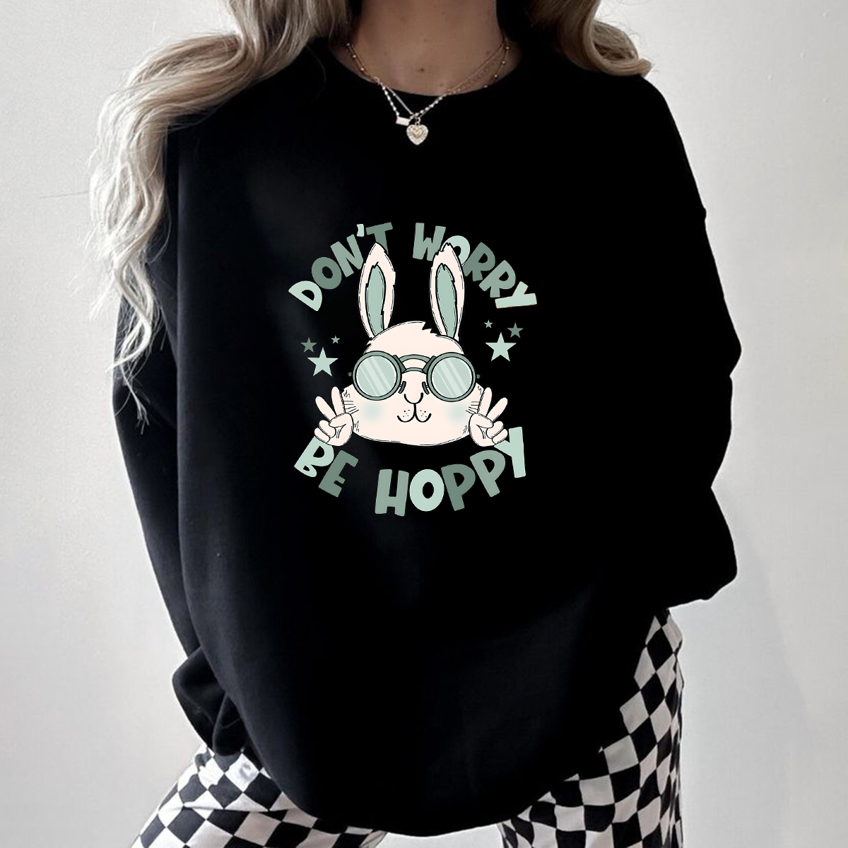 "Don'T Hoppy" Slogan And The Image Of A Rabbit Wearing Sunglasses, A Rabbit Holding Up Two Fingers And Making A "V" Sign, A Casual Sports Shirt, And A Crew Neck Sweatshirt.