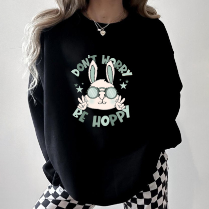 "Don'T Hoppy" Slogan And The Image Of A Rabbit Wearing Sunglasses, A Rabbit Holding Up Two Fingers And Making A "V" Sign, A Casual Sports Shirt, And A Crew Neck Sweatshirt.