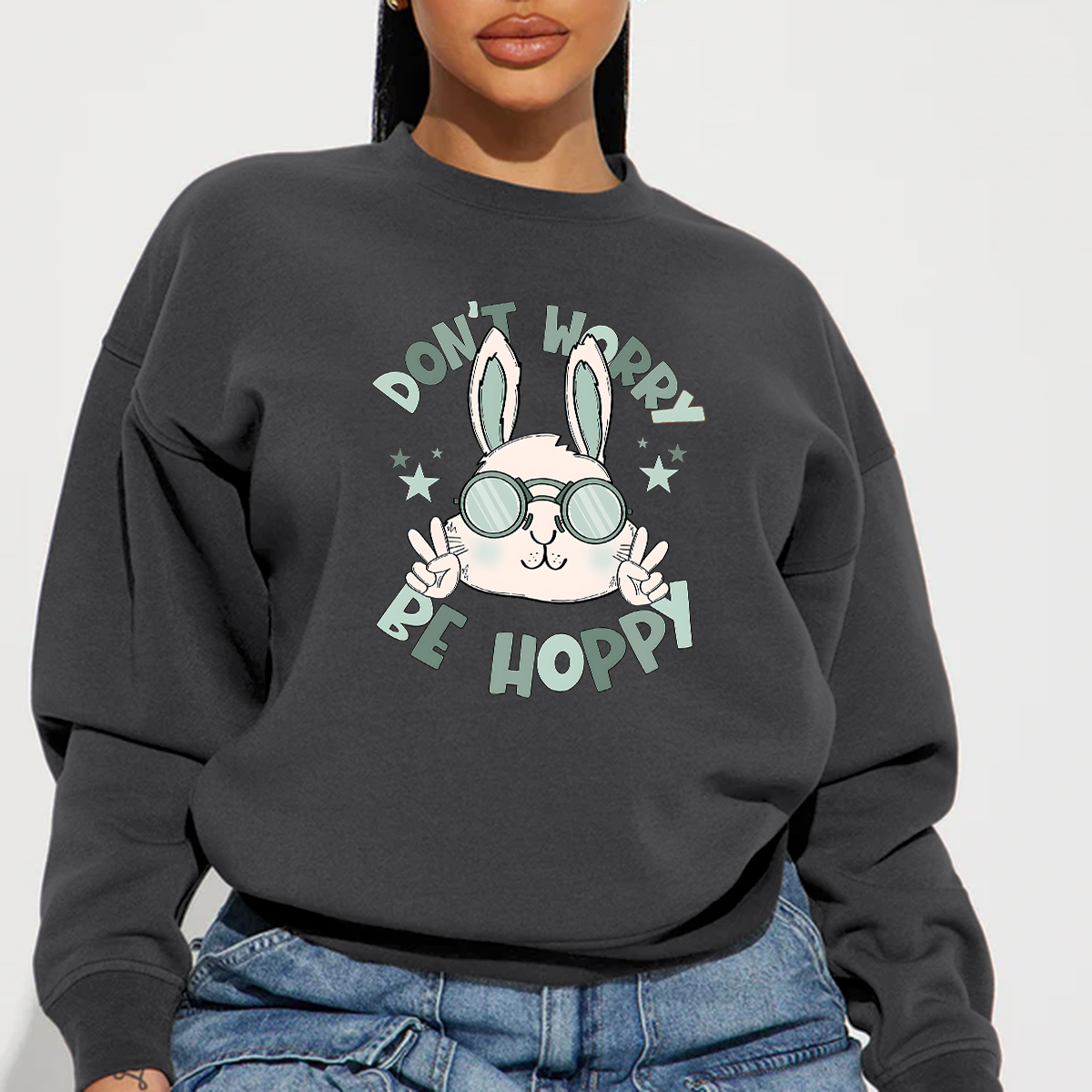 "Don'T Hoppy" Slogan And The Image Of A Rabbit Wearing Sunglasses, A Rabbit Holding Up Two Fingers And Making A "V" Sign, A Casual Sports Shirt, And A Crew Neck Sweatshirt.