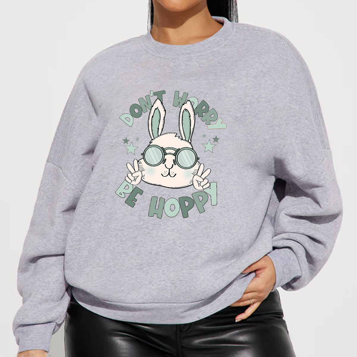 "Don'T Hoppy" Slogan And The Image Of A Rabbit Wearing Sunglasses, A Rabbit Holding Up Two Fingers And Making A "V" Sign, A Casual Sports Shirt, And A Crew Neck Sweatshirt.