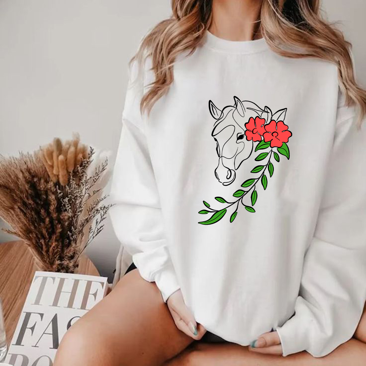 The Horse'S Head Is Decorated With Red Flowers And Green Branches And 