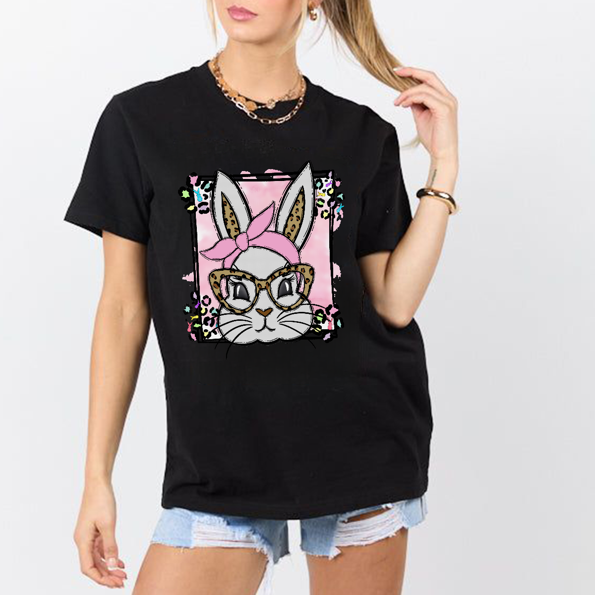A Cartoon Rabbit Image. The Rabbit Is Wearing A Pink Headscarf, Leopard Print Glasses, A Pink Checkered Background, Colorful Flowers Around, And A Casual T-Shirt.