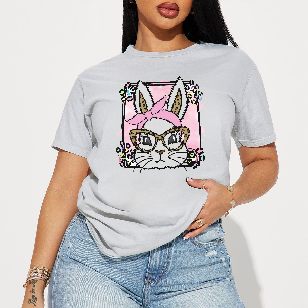 A Cartoon Rabbit Image. The Rabbit Is Wearing A Pink Headscarf, Leopard Print Glasses, A Pink Checkered Background, Colorful Flowers Around, And A Casual T-Shirt.