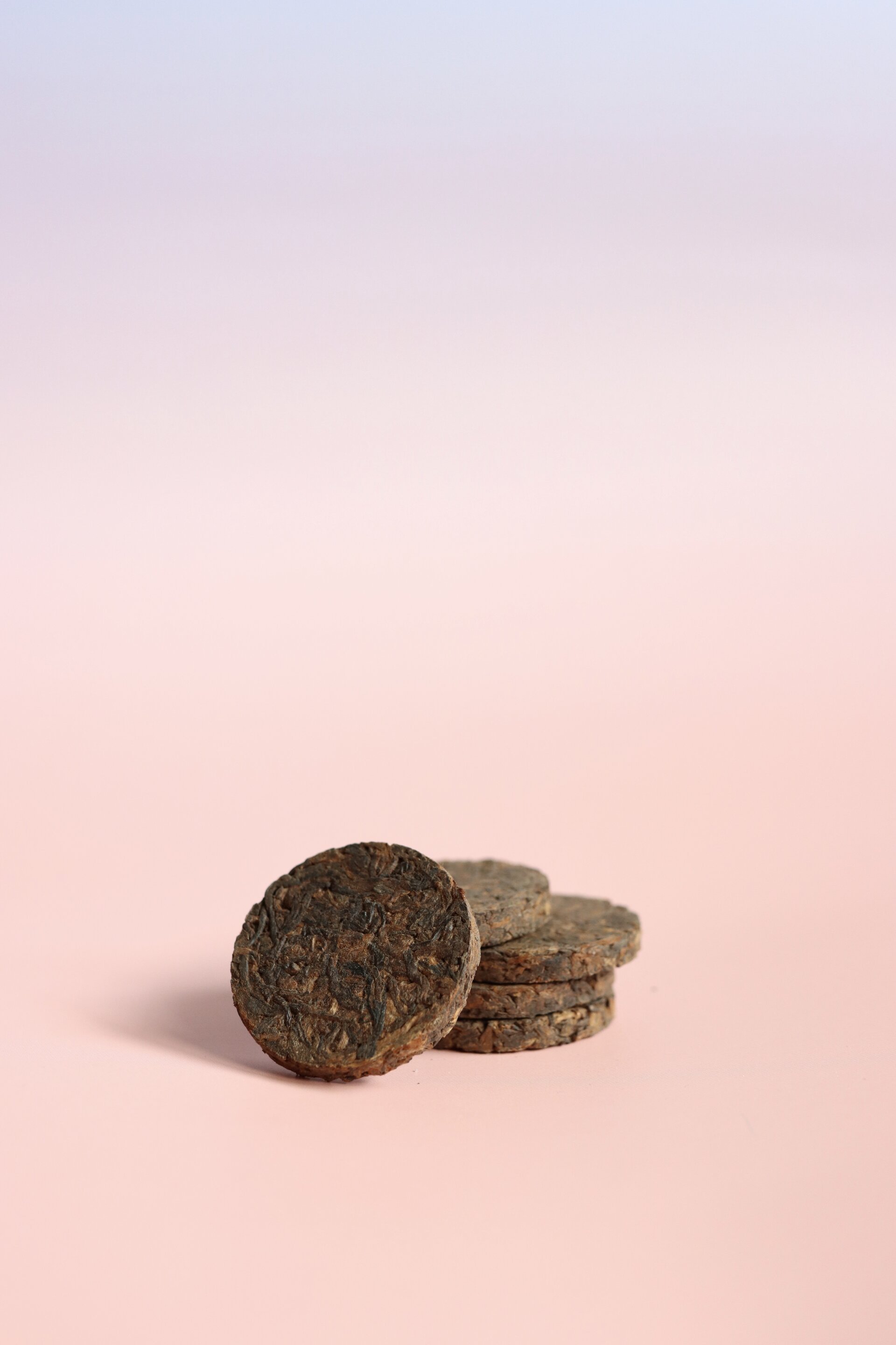Yunnan Pu'er fermented black tea (cooked pu'er) presented as a pressed tea tea token