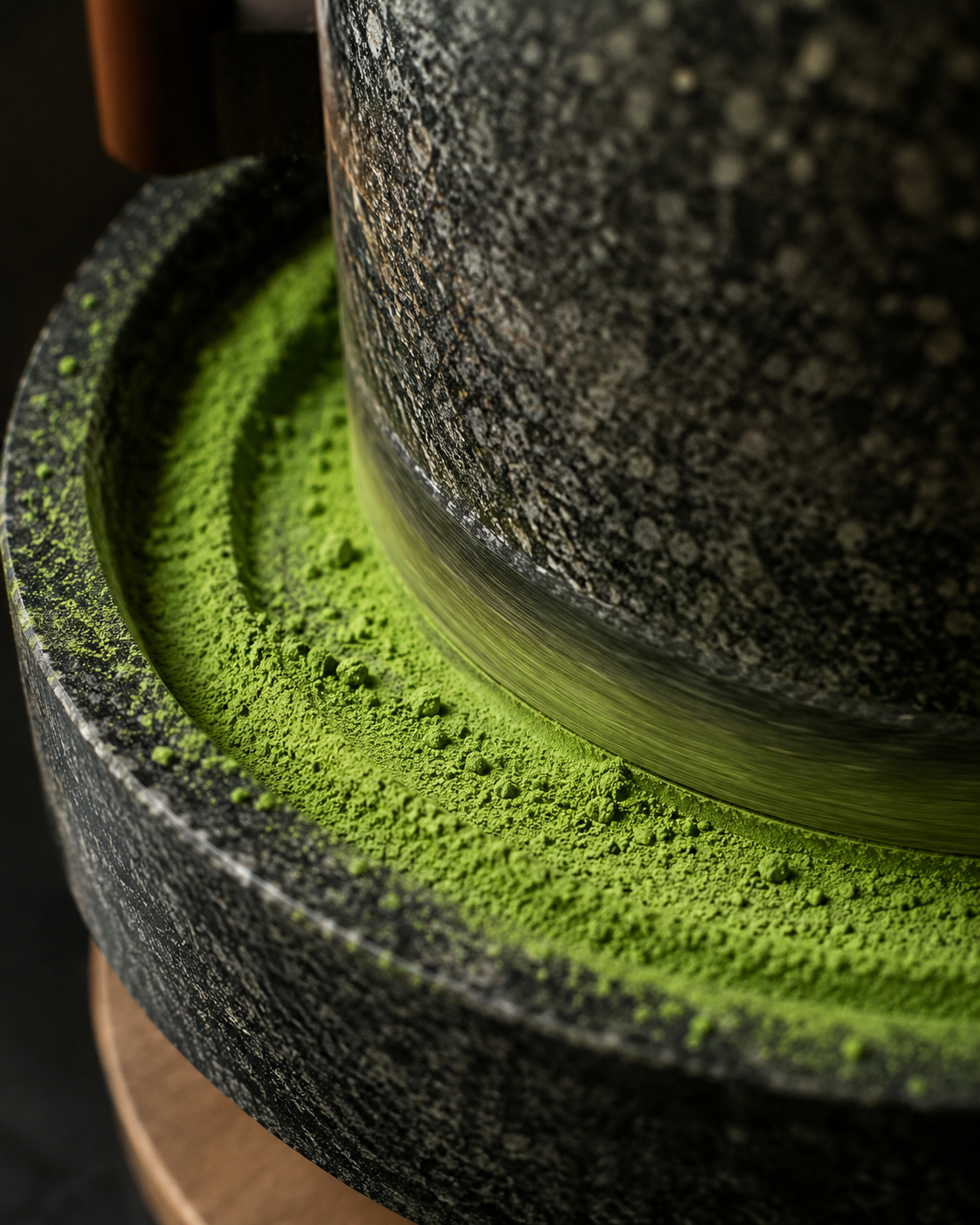 Milling dried tencha leaves into a fine matcha powder.