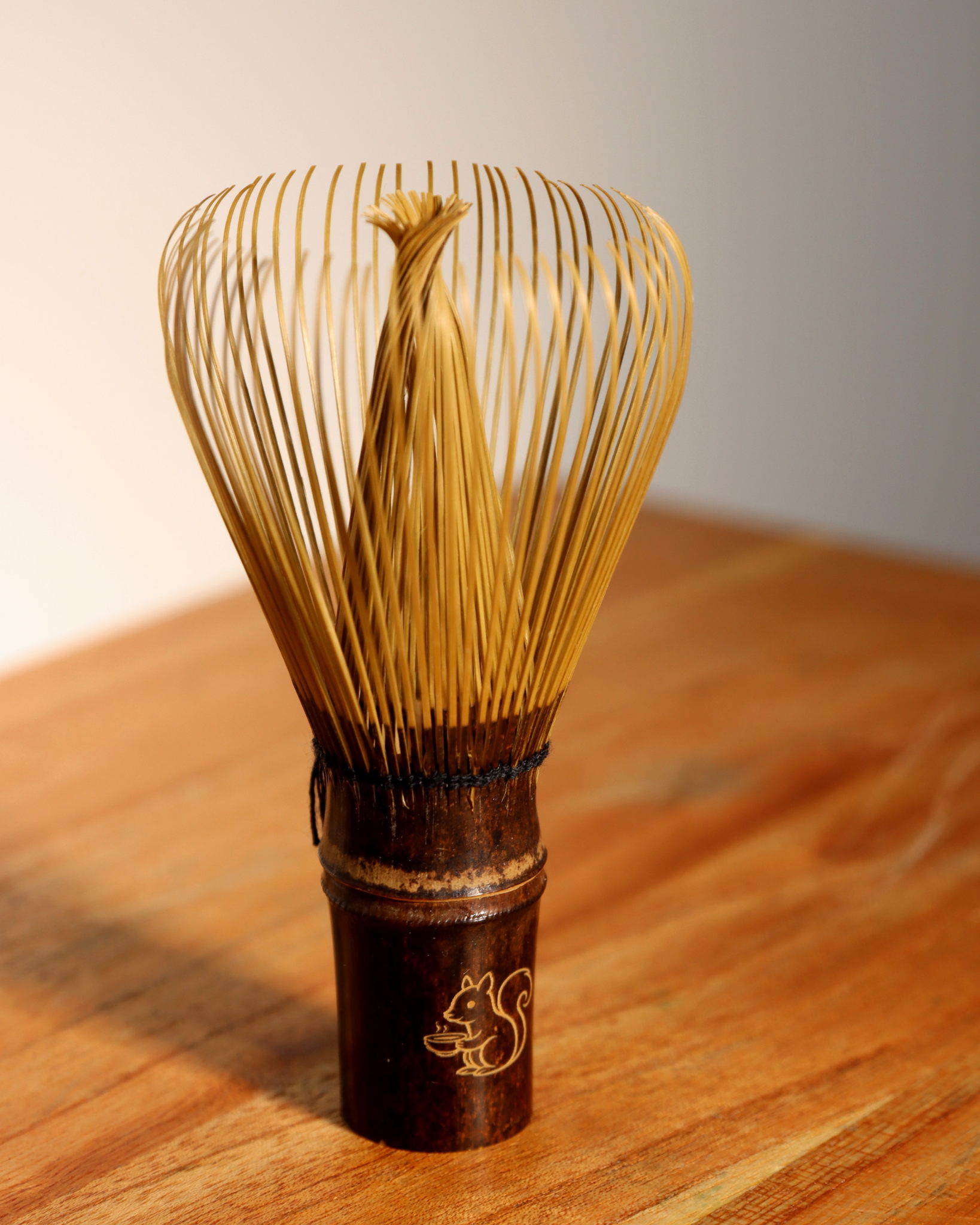 brut tea's "Kazuho" white bamboo chaser - a handcrafted matcha whisk.