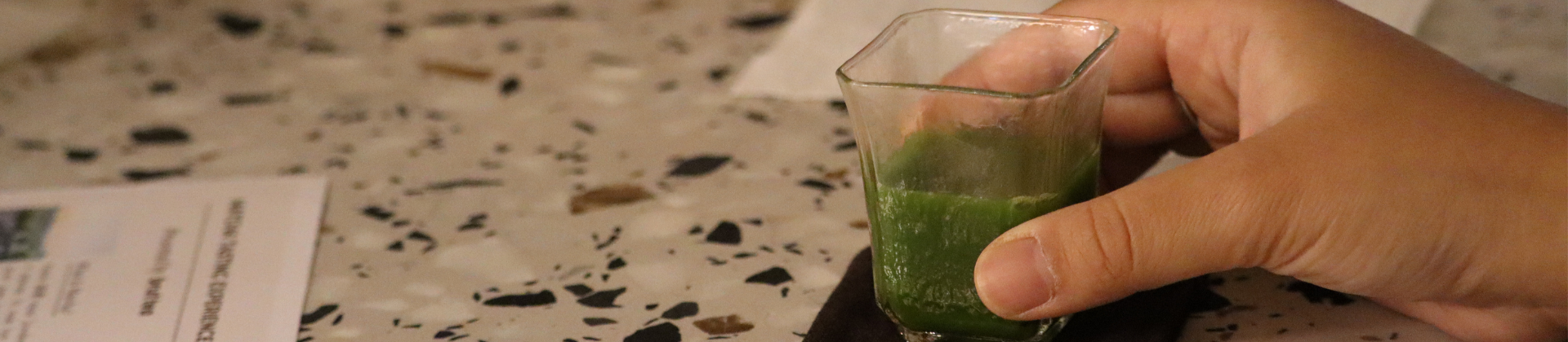 A matcha usucha in a clear glass teacup served during a matcha workshop