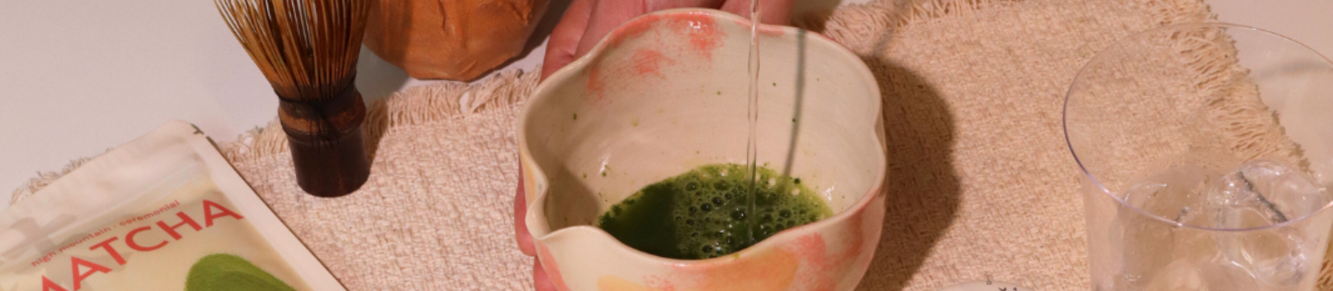 Preparing matcha with bamboo whisk and tools using various matcha accessories and equipment like chasen, chawan and chashaku