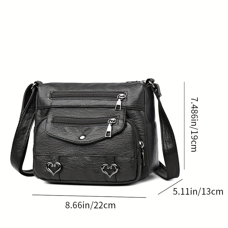 🎀Retro crossbody kabelka s více kapsami, taška přes rameno z měkké PU kůže, dámská kabelka s kovovým srdcem 💼