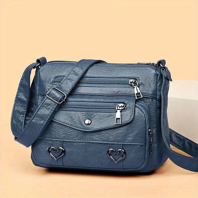 🎀Retro crossbody kabelka s více kapsami, taška přes rameno z měkké PU kůže, dámská kabelka s kovovým srdcem 💼