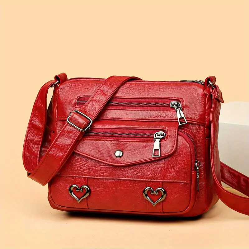 🎀Retro crossbody kabelka s více kapsami, taška přes rameno z měkké PU kůže, dámská kabelka s kovovým srdcem 💼