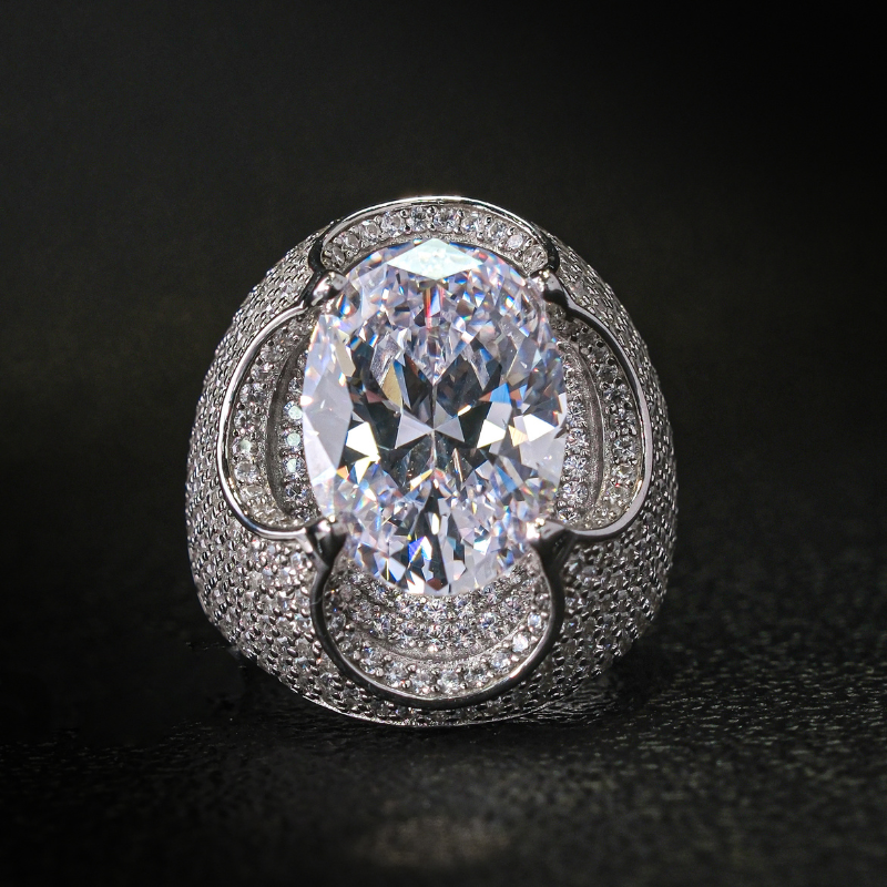 Kiss The Ring Of A Moissanite Oval Spessartine Ring