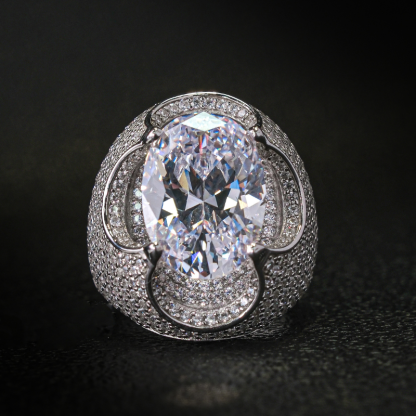 Kiss The Ring Of A Moissanite Oval Spessartine Ring